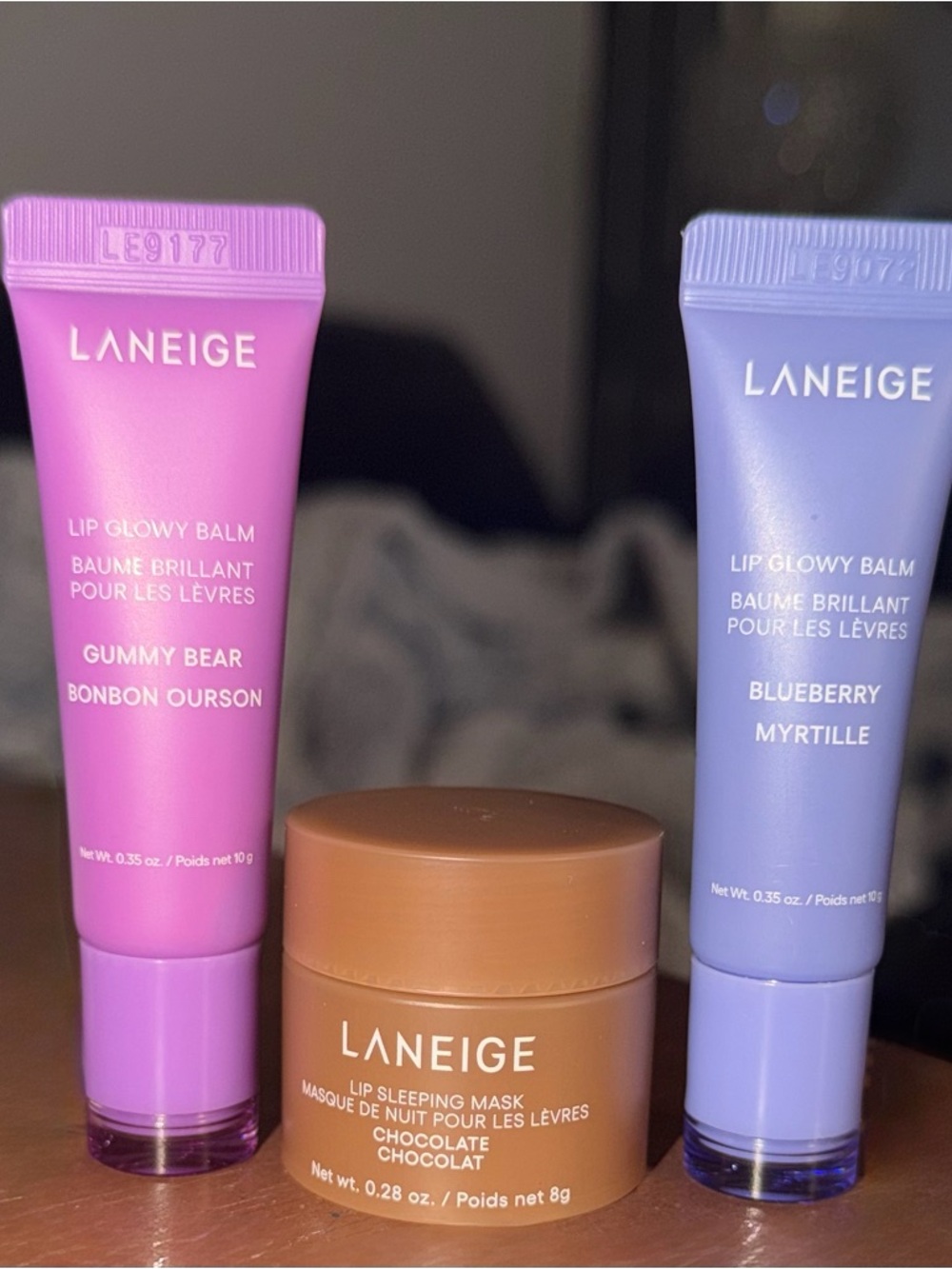 Laneige lip glowy balm in blueberry and gummy bear and chocolate sleeping mask.